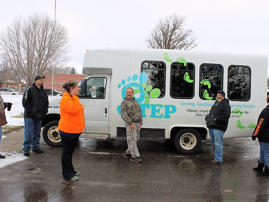 People waiting for ride on the STEP Transportation bus