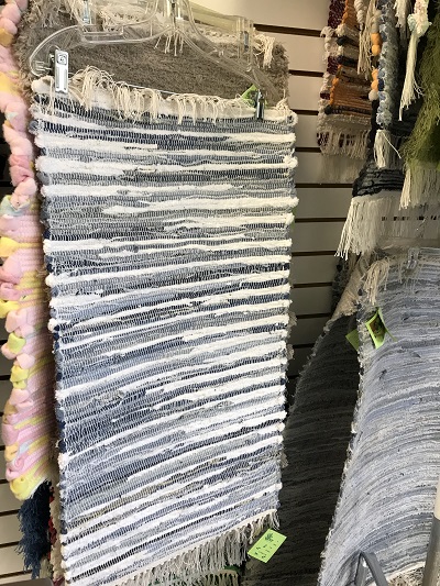 STEP hand-loomed rugs on display for sale at STEP Sauk Centre.